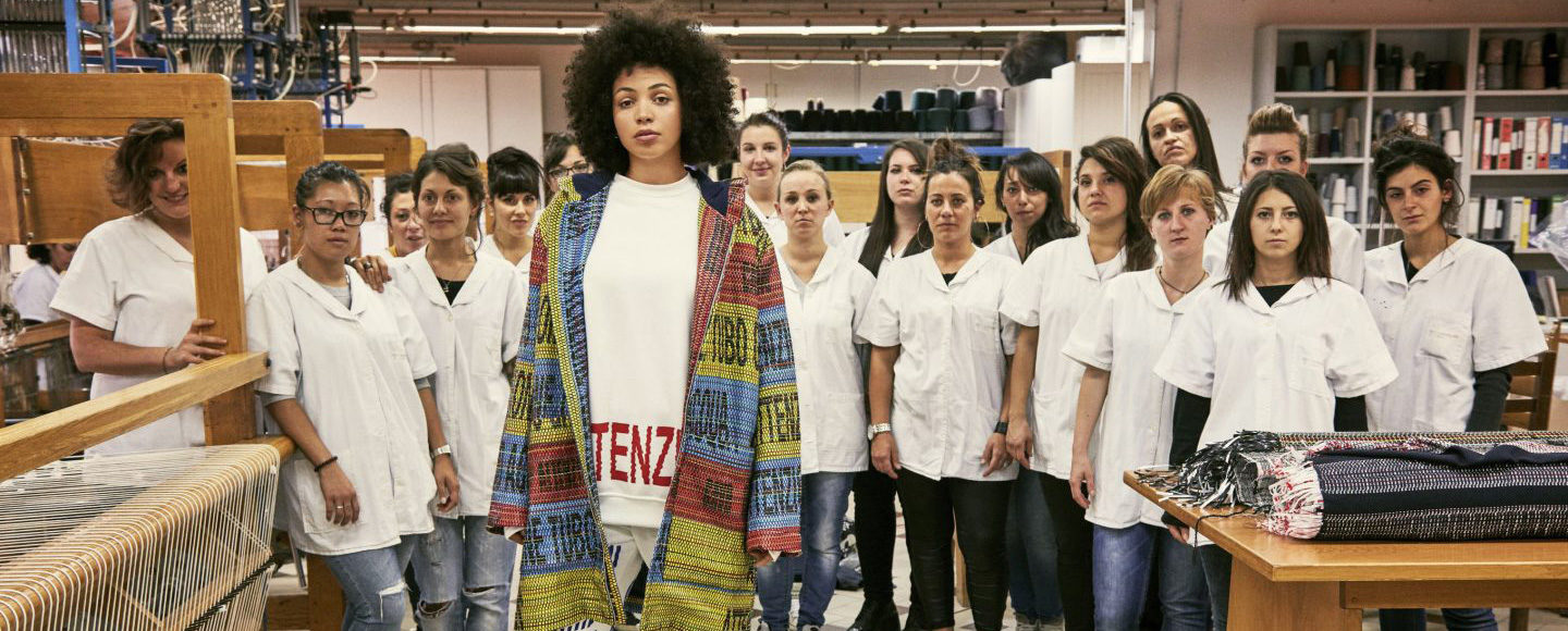 A jacket is shown designed by Bethany Williams in a studio