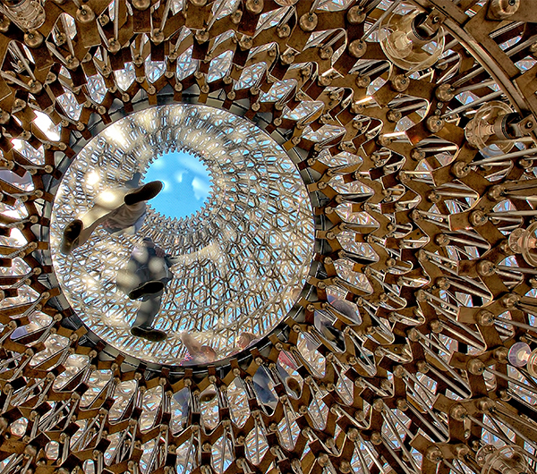 A picture is shown with fine details of repeated patterns which almost look like pheasant's feathers interwoven into each other in shades of brown colour