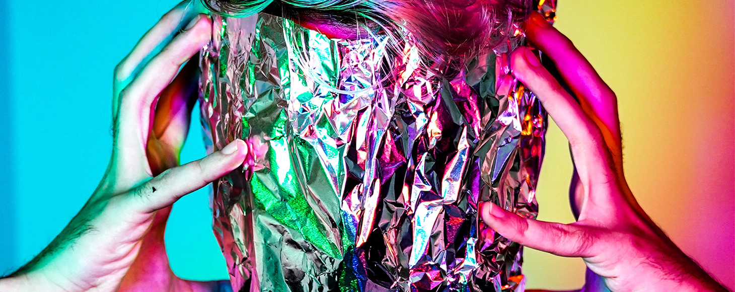 Male model with foil wrapped on his face