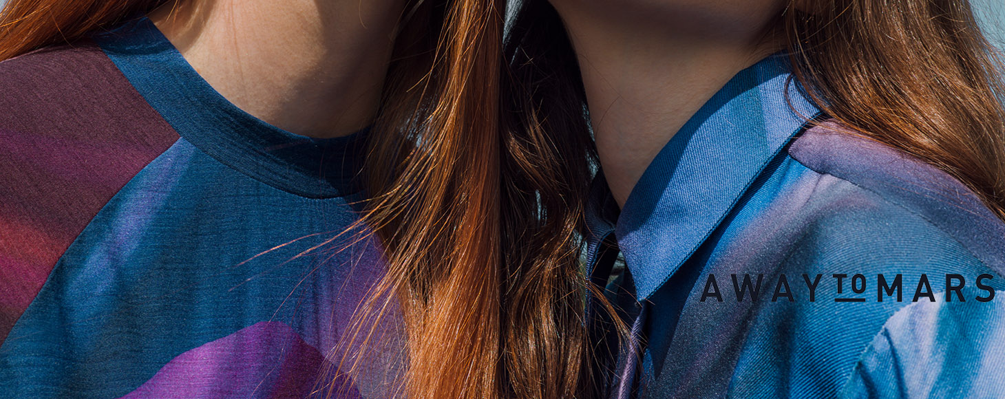 Away to Mars which is a fashion co-creation platform showing its collection in close up details. Two female models are wearing blue and burgundy dresses