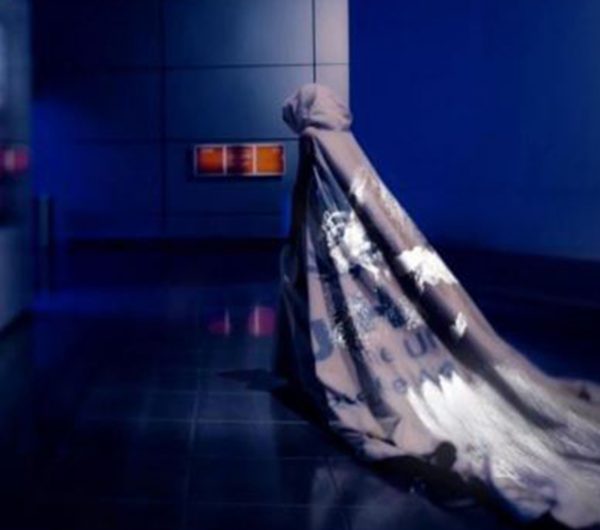 A model walks wearing a dress designed by Helen Storey, the installation showcase the data visulaisation