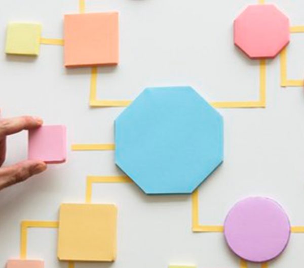 A board with triangles, circles and squares cut in different shapes