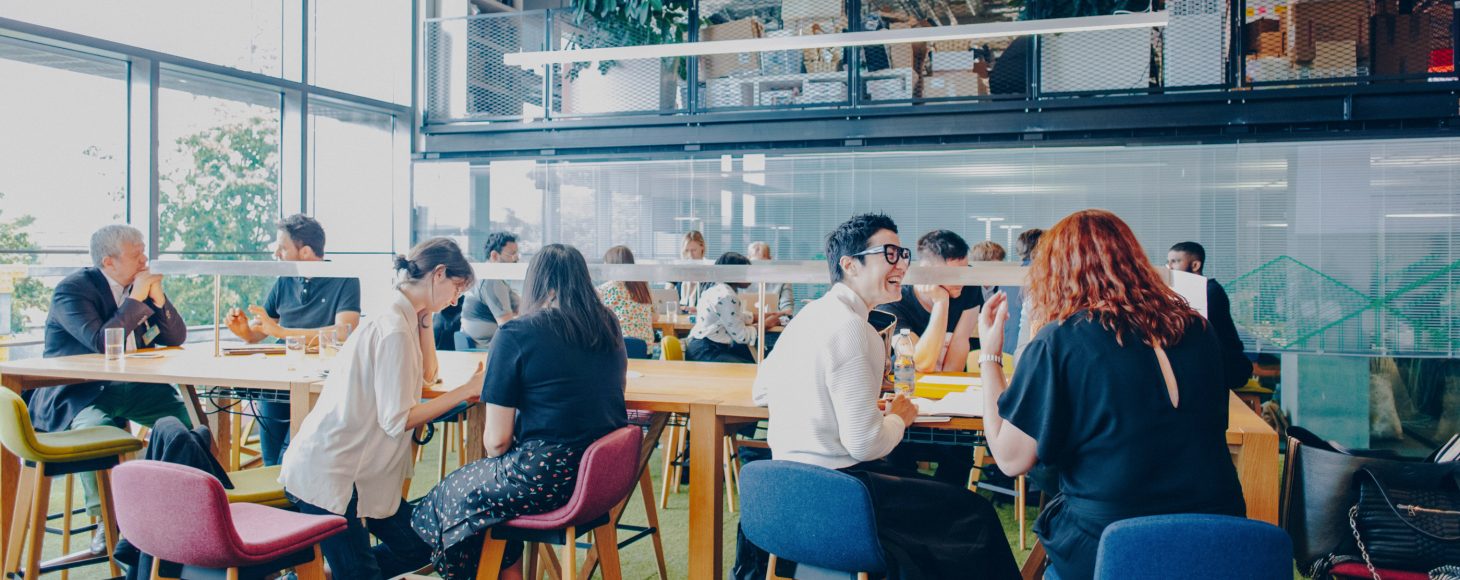 A group of people sat in a cafe