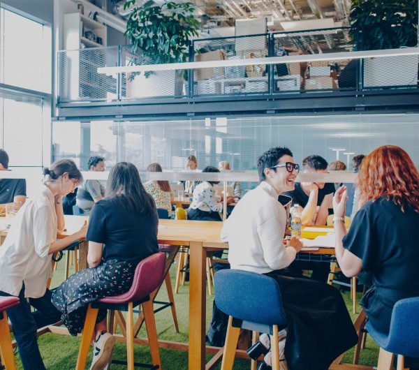 A group of people sat in a cafe