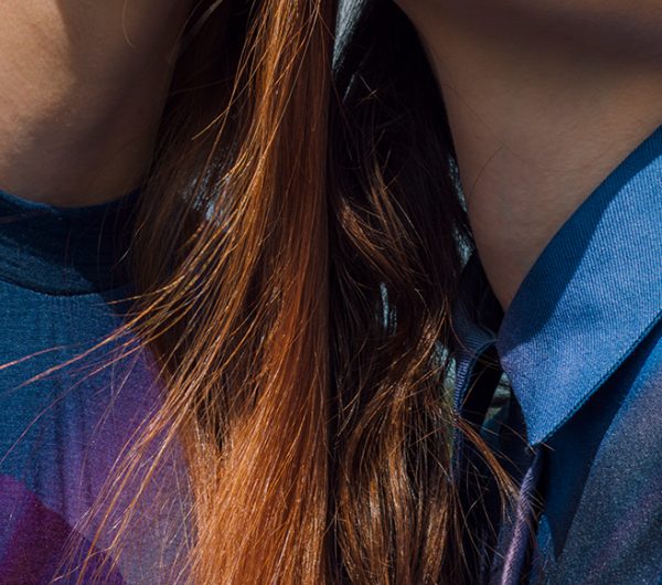 Two female models wearing blue garments