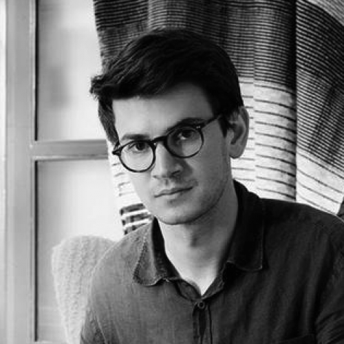 black and white portrait of Sam Reich