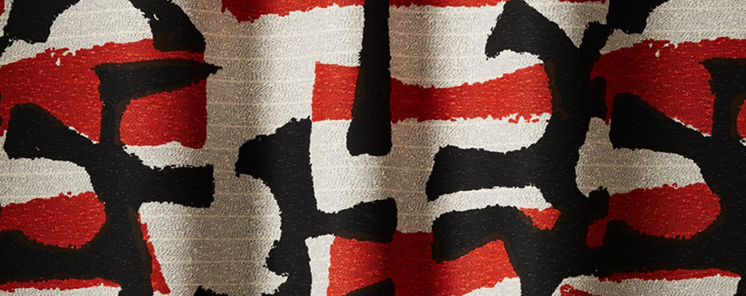 Woven fabric with red and black pattern